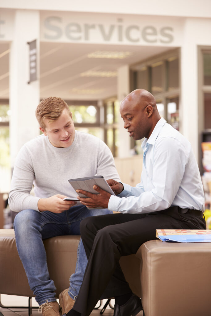 Teen boy working with his guidance counselor