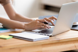 Teen girl writing her college essay online