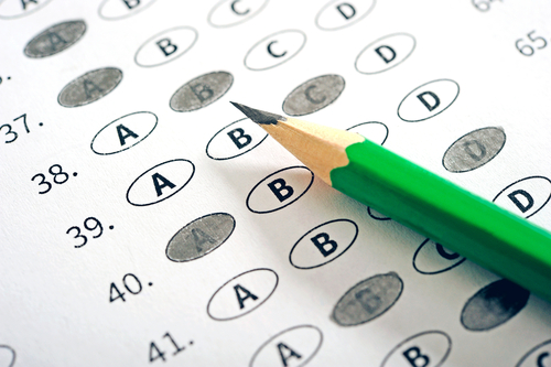 Standardized test sheet with a green pencil